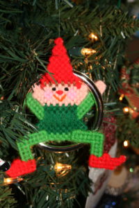 another ornament--an elf sitting in ring