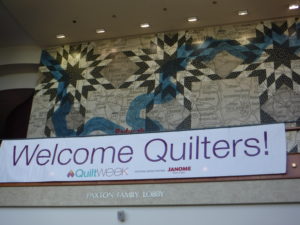 a huge quilt-themed welcome sign