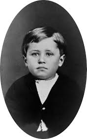 Image of a young boy in 1876s clothing